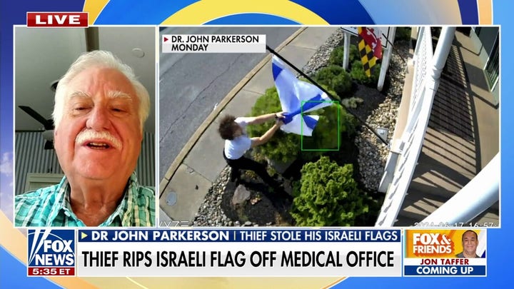 Thief caught on camera stealing Israeli flag from medical office: 